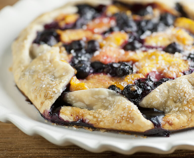 Easy blueberry peach tart on a plate.