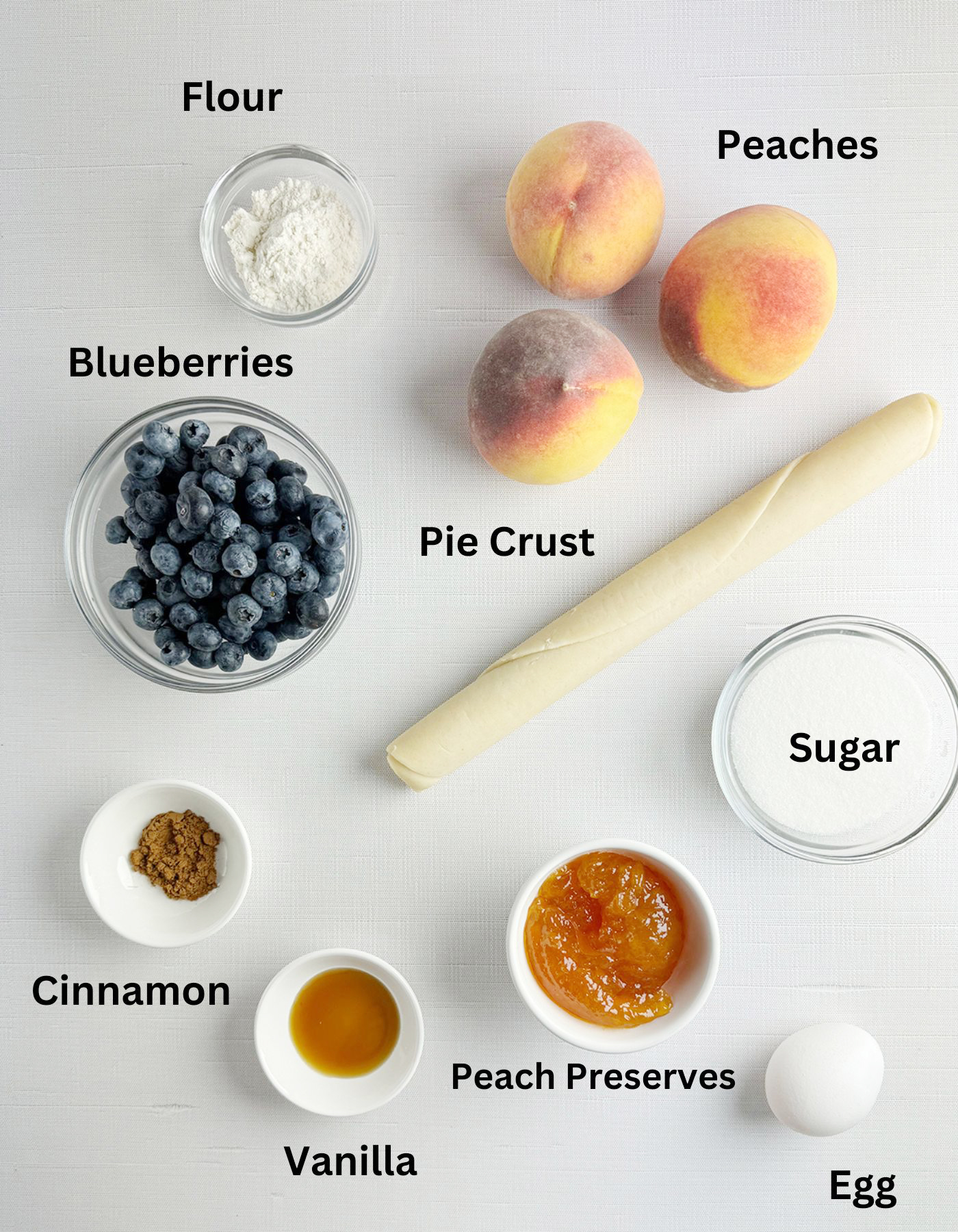 Ingredients needed for a blueberry peach tart.
