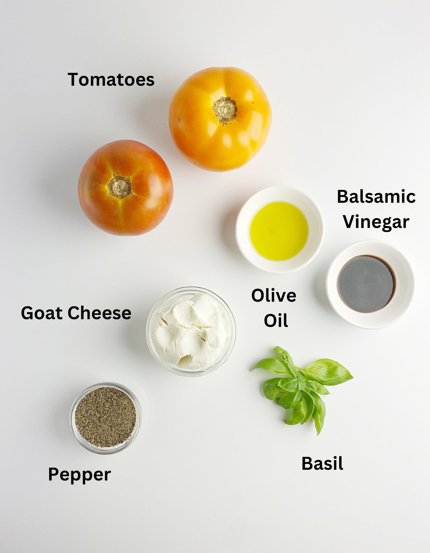Ingredients needed for a tomato goat cheese salad.