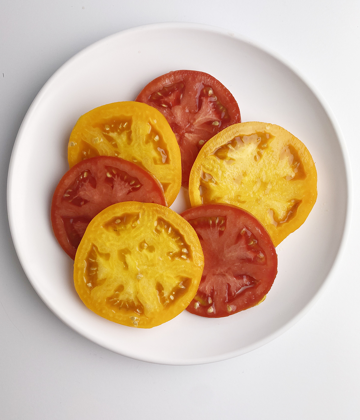 Sliced tomatoes on a plate.