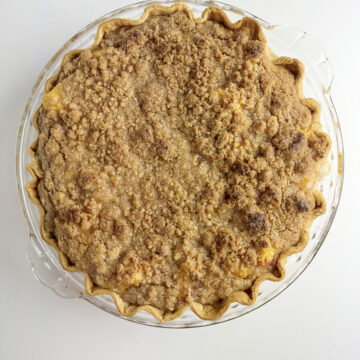 Baked fresh peach pie out of the oven.