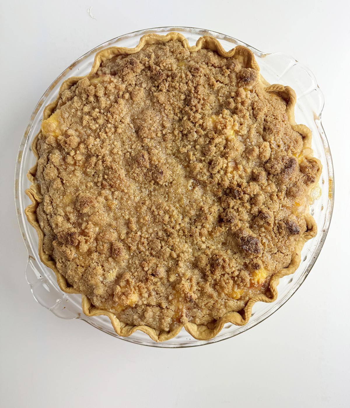 Baked fresh peach pie out of the oven.