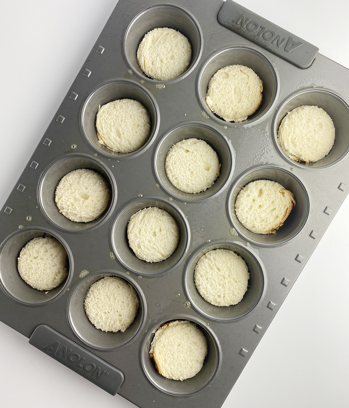 Bread circles in a muffin tin.