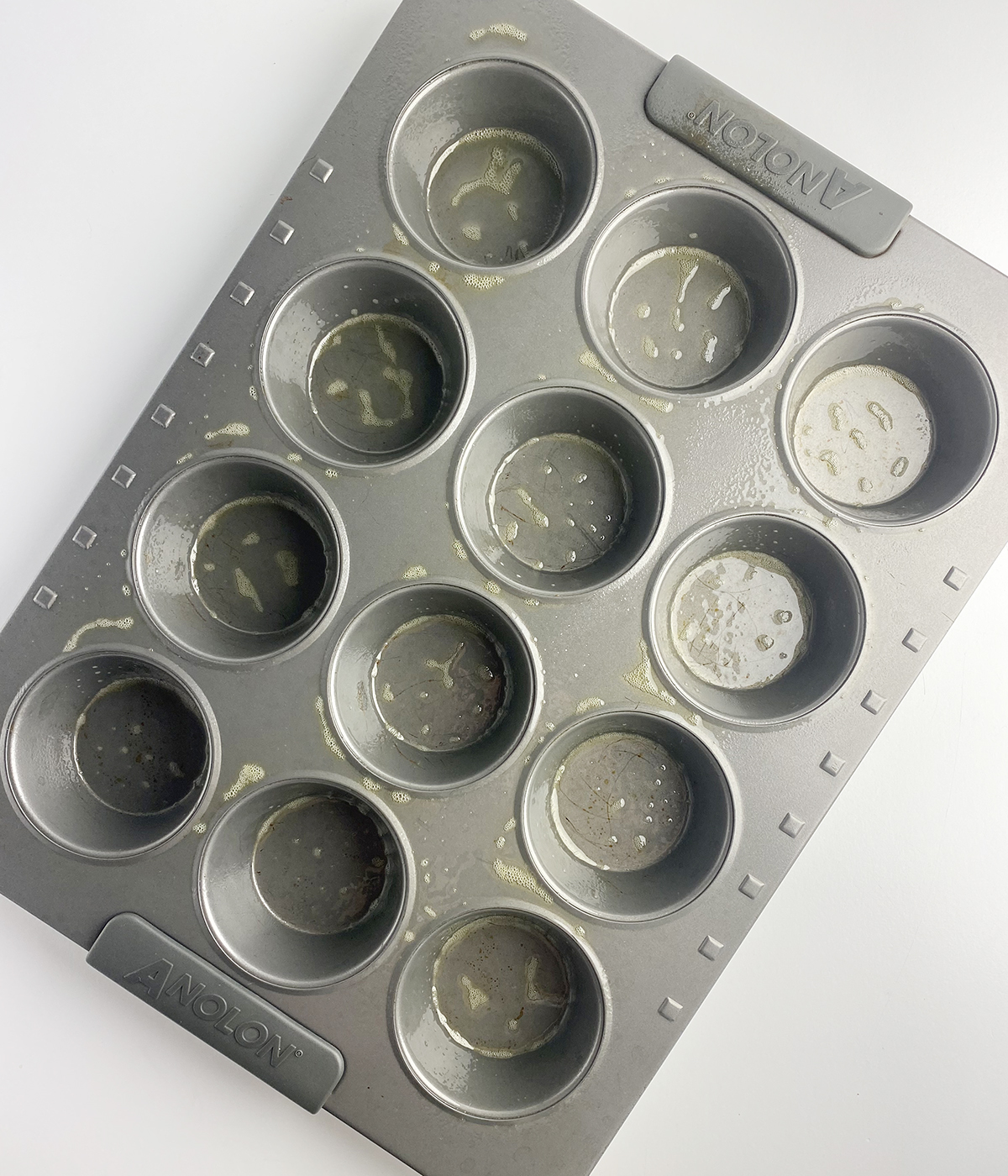 Greased 12 cup muffin tin.