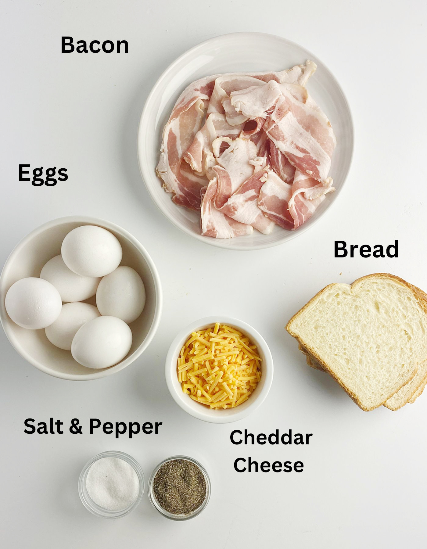 Ingredients needed for bacon egg and cheese muffins on a counter.