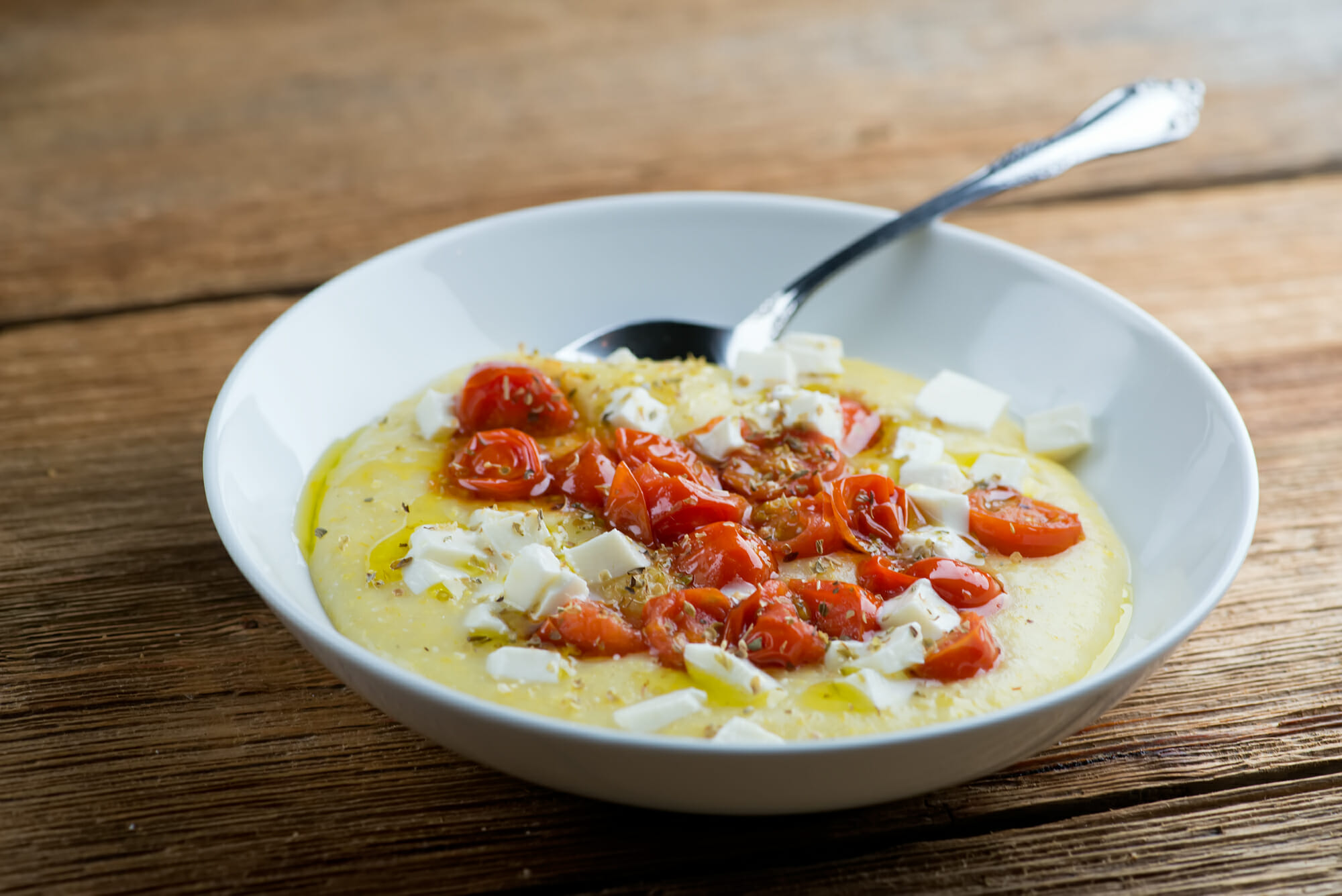 tomato mozzarella polenta Tomato mozzarella polenta in a bowl.