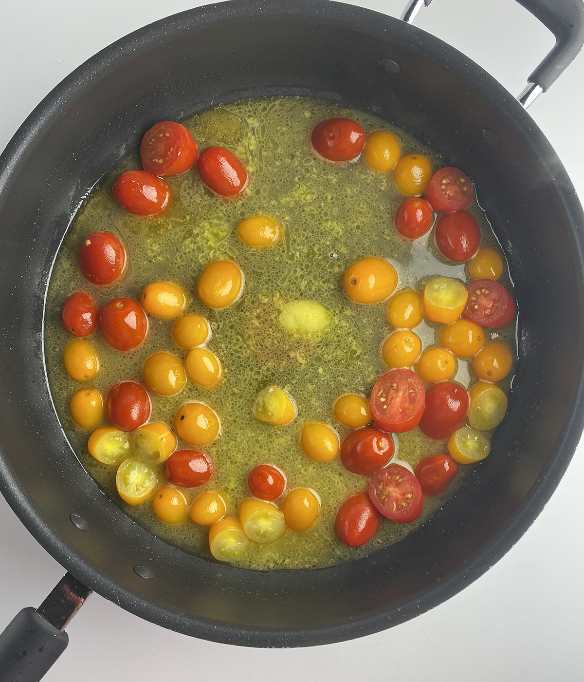 White wine tomato sauce in a skillet.