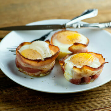 Bacon and egg muffins on a plate.