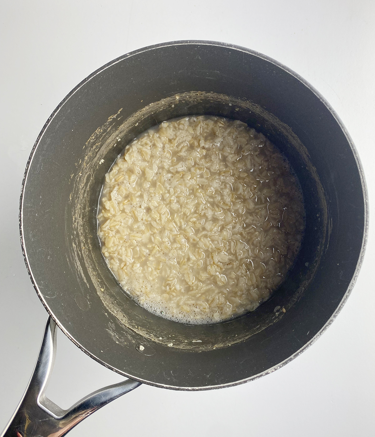 Cooked oatmeal in a pot.