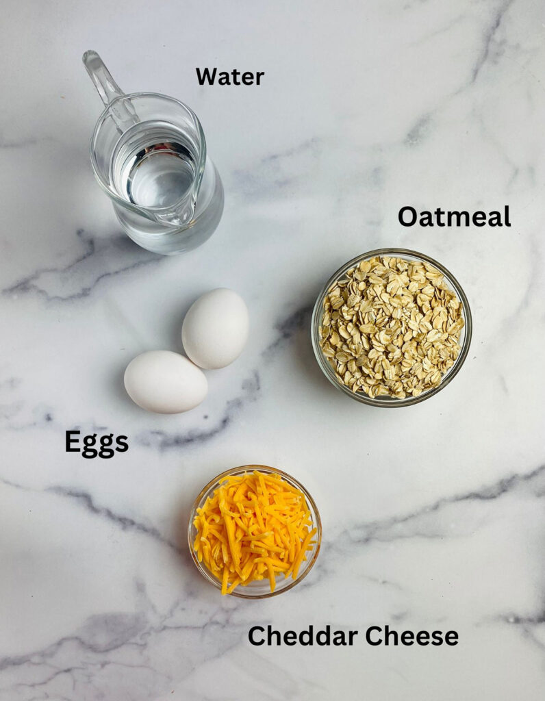 Ingredients for savory oatmeal with eggs on a marble counter.
