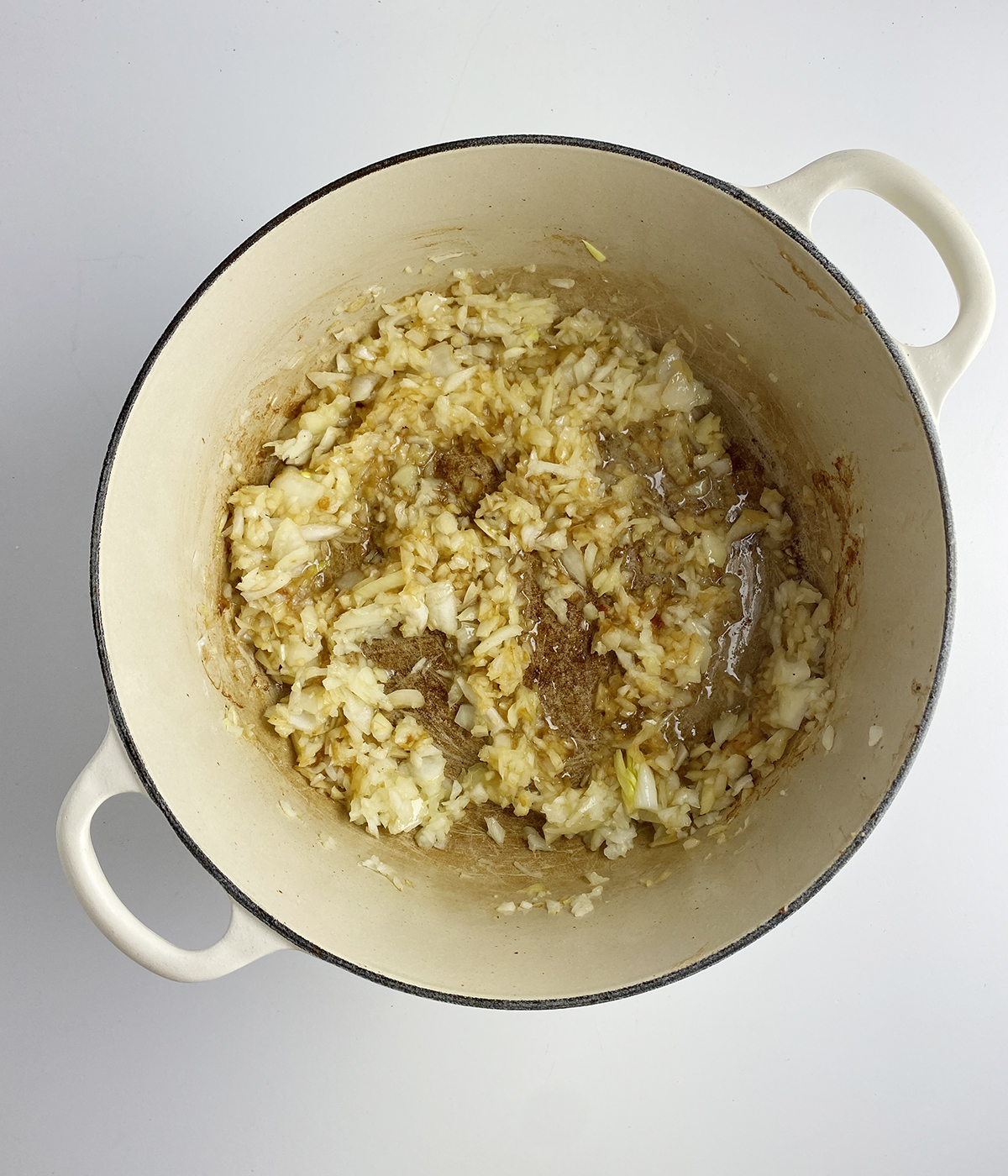 Sauteed onions in a pot.