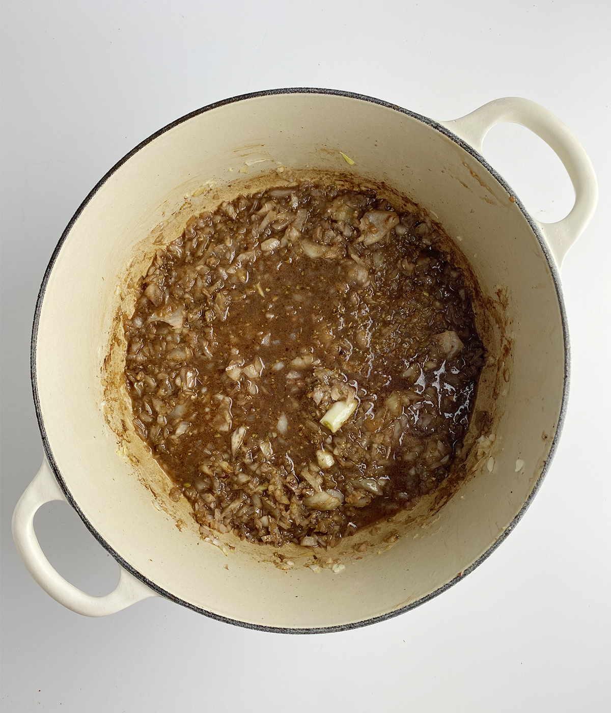 Spiced onion mixture in a pot.