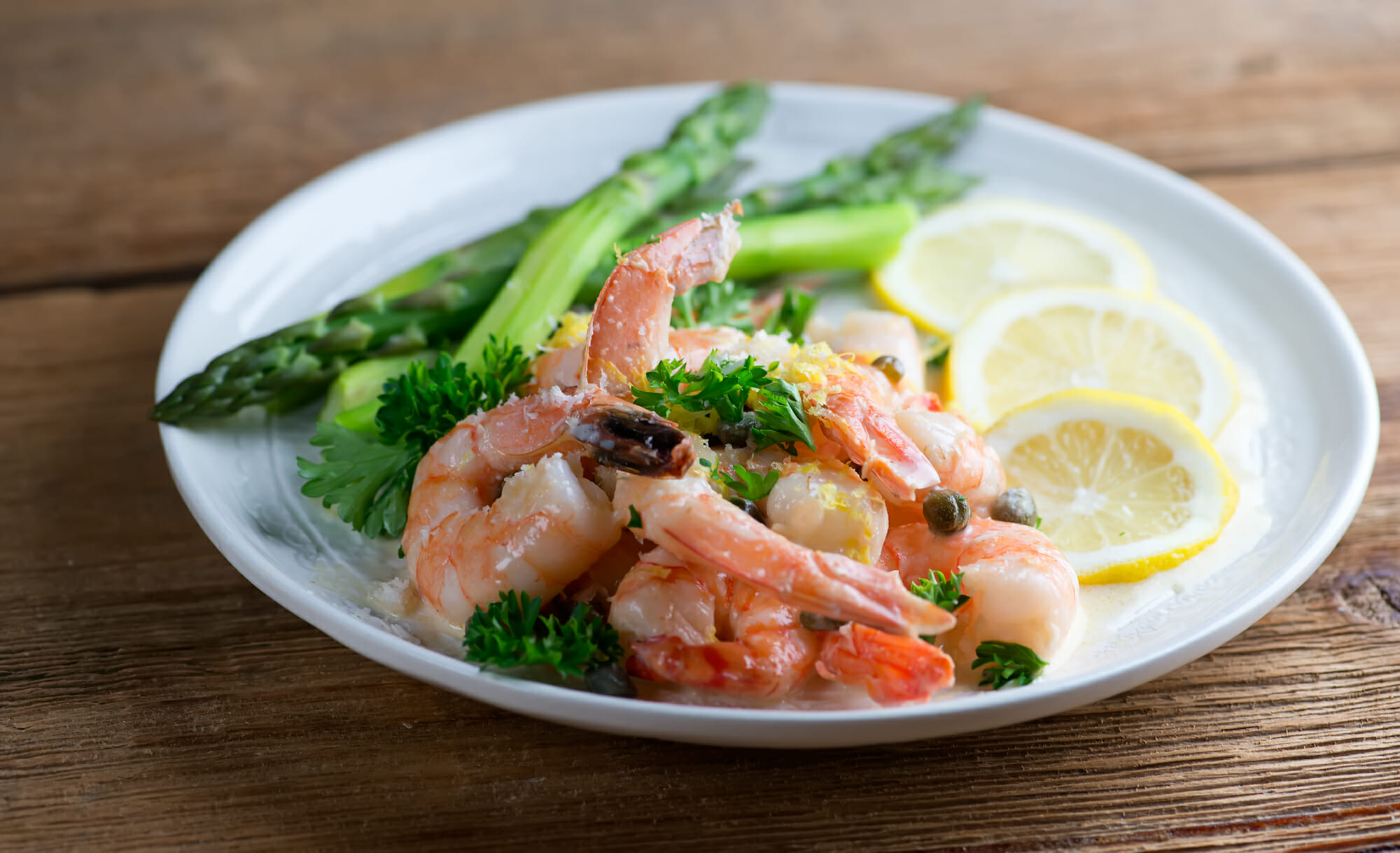 easy creamy shrimp piccata Easy creamy shrimp piccata ona plate with asparagus.
