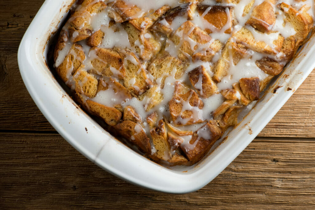 Pan of baked cinnamon roll bread pudding.