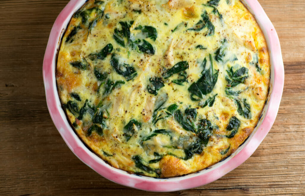 Cheesy Chicken Spinach Oven Frittata Chicken Spinach Frittata in a pie plate.