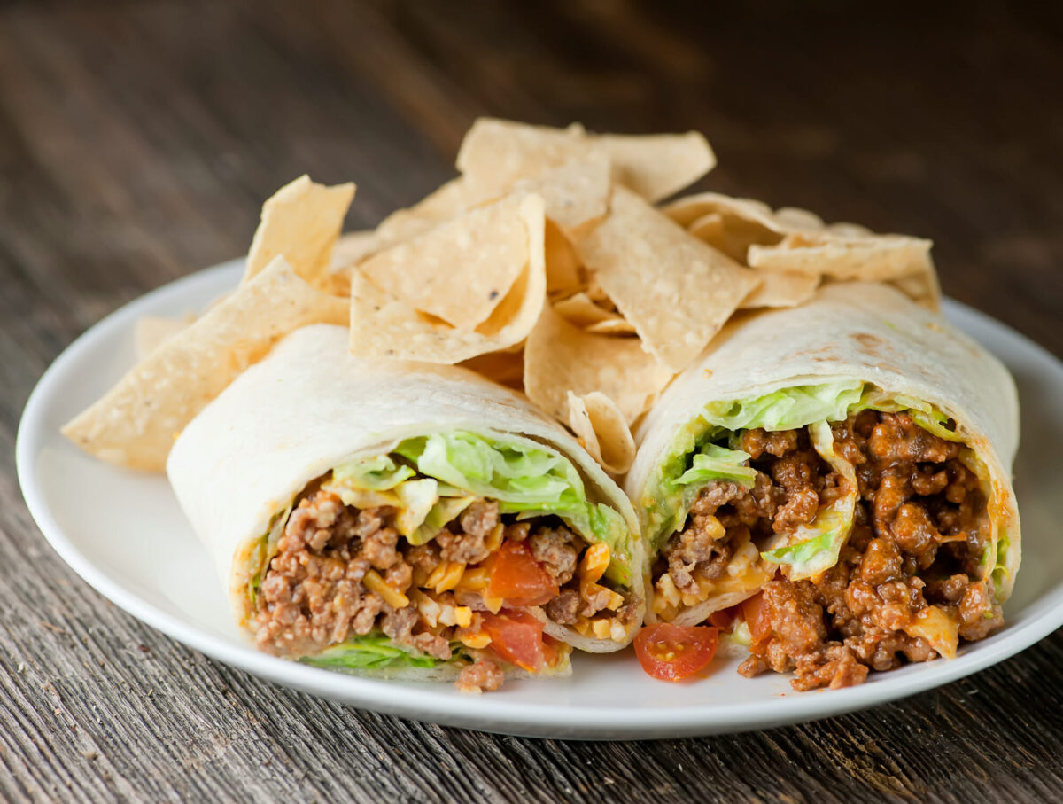 taco wraps Taco wraps on a plate with tortilla chips on the side.