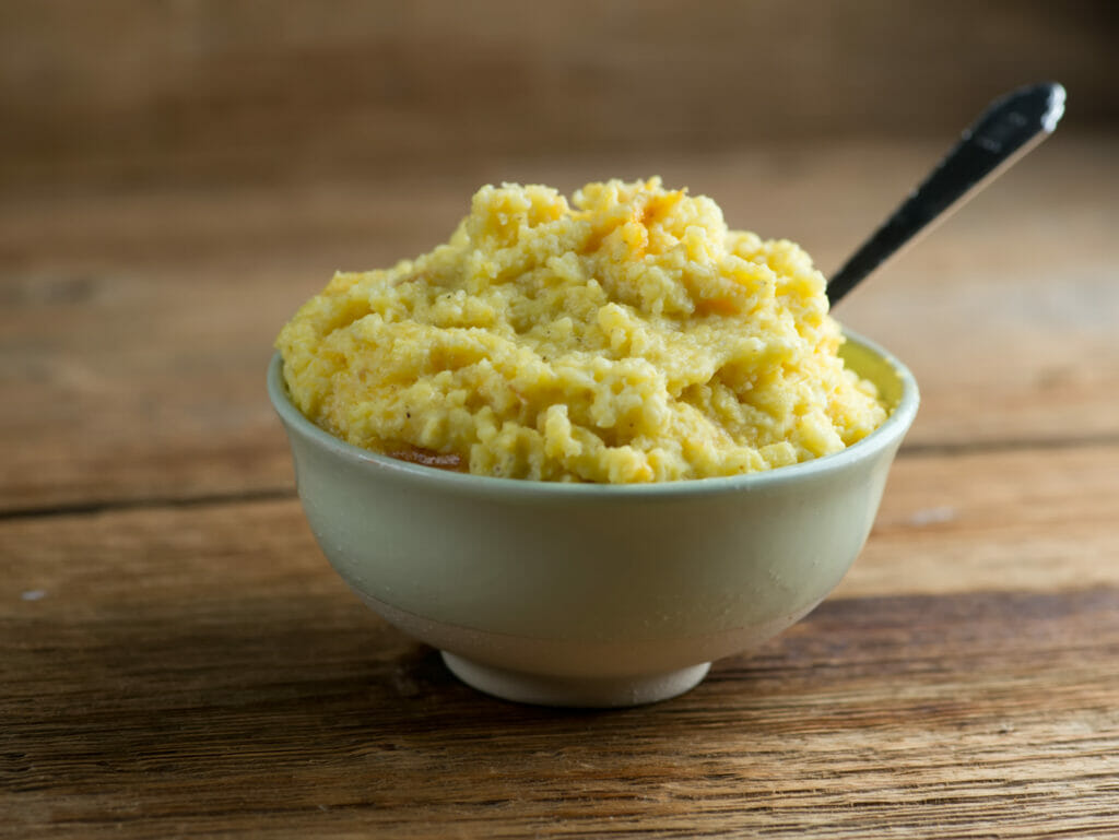 Bowl of cheesy Southern spoonbread.