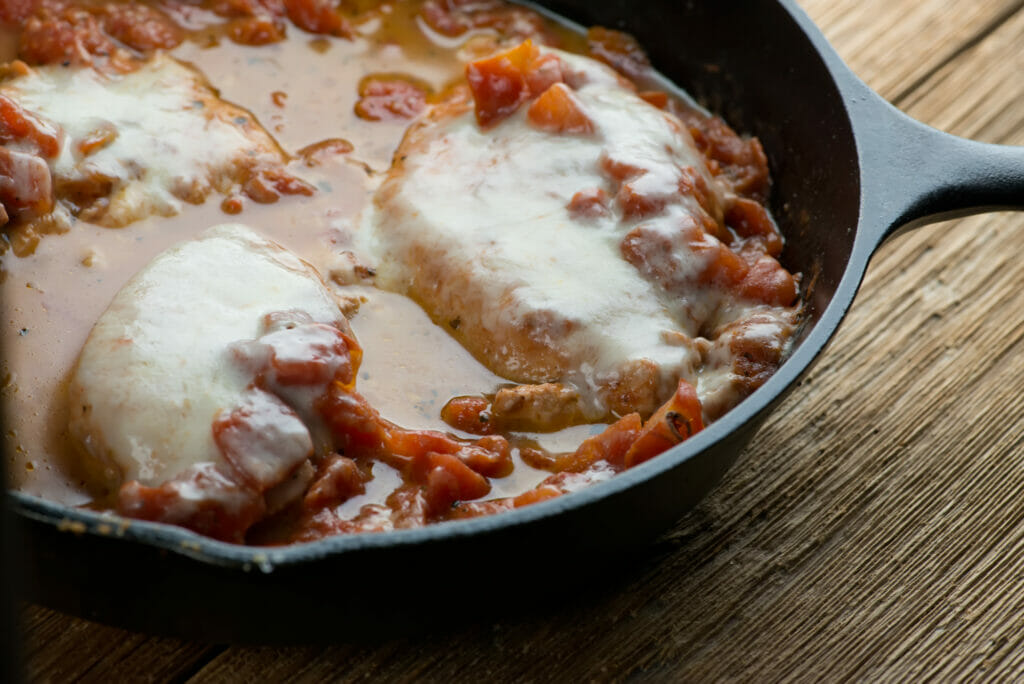 One pan chicken parmesan in a cast iron skillet.