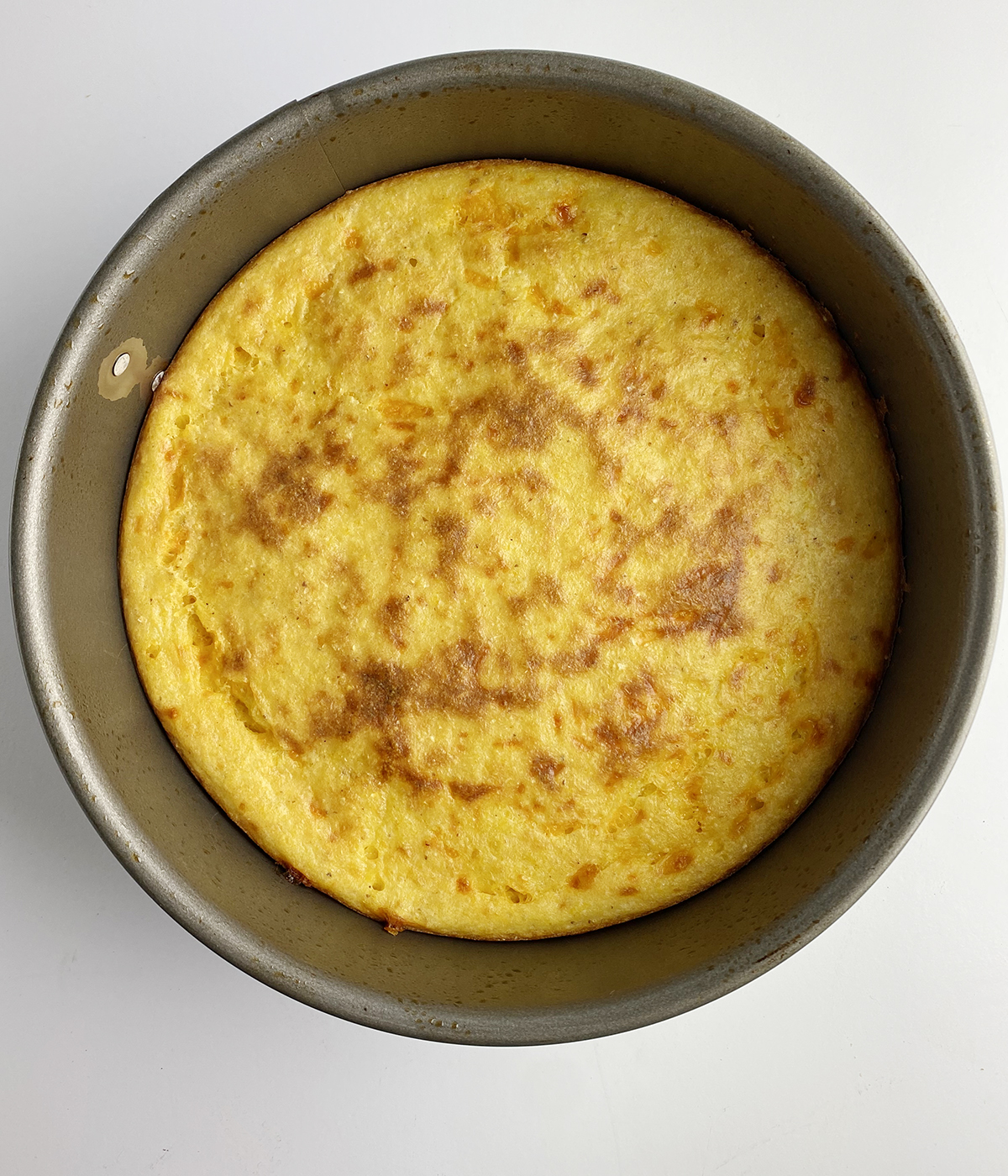Baked spoonbread in a pan.