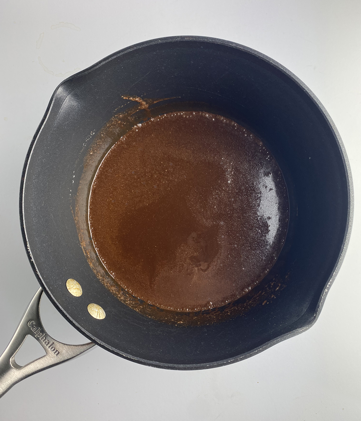 Pot full of melted chocolate.