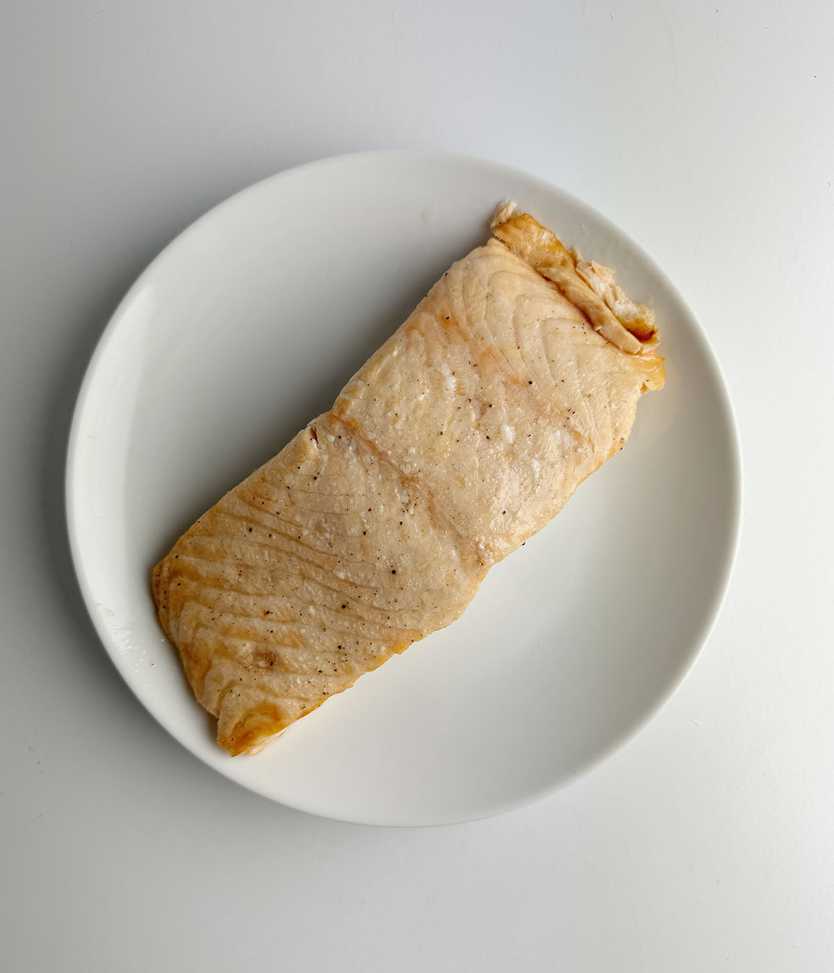 Roasted salmon filet on a plate.