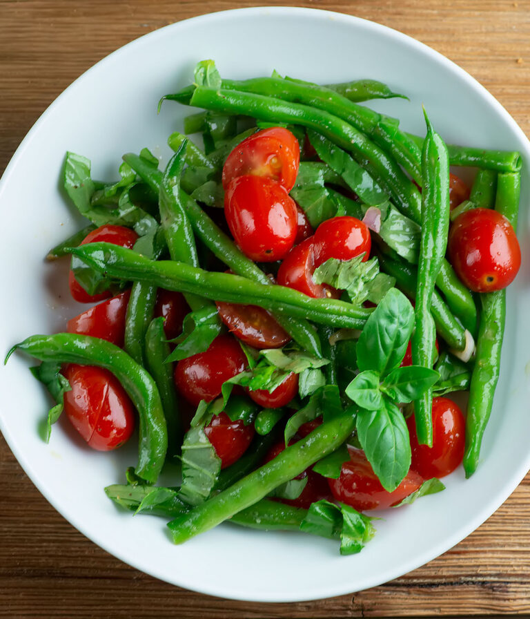 Cherry tomato green bean salad in a bowl.