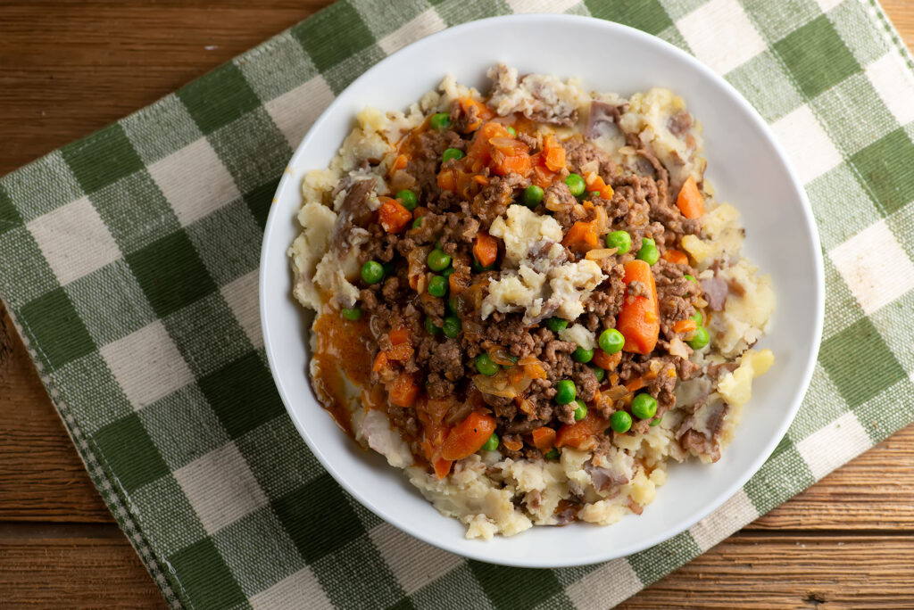 Upside down shepherds pie in a bowl.
