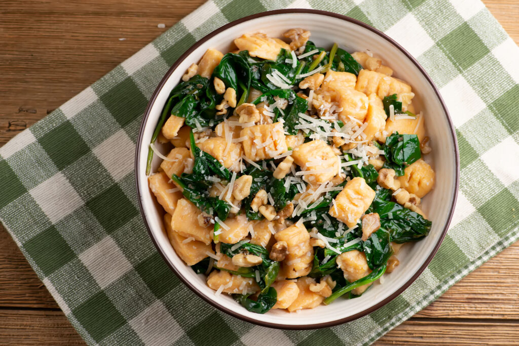 sweet potato gnocchi with spinach and walnuts