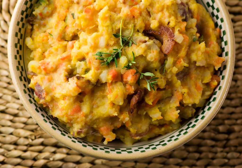 A bowl of mashed fall vegetables.