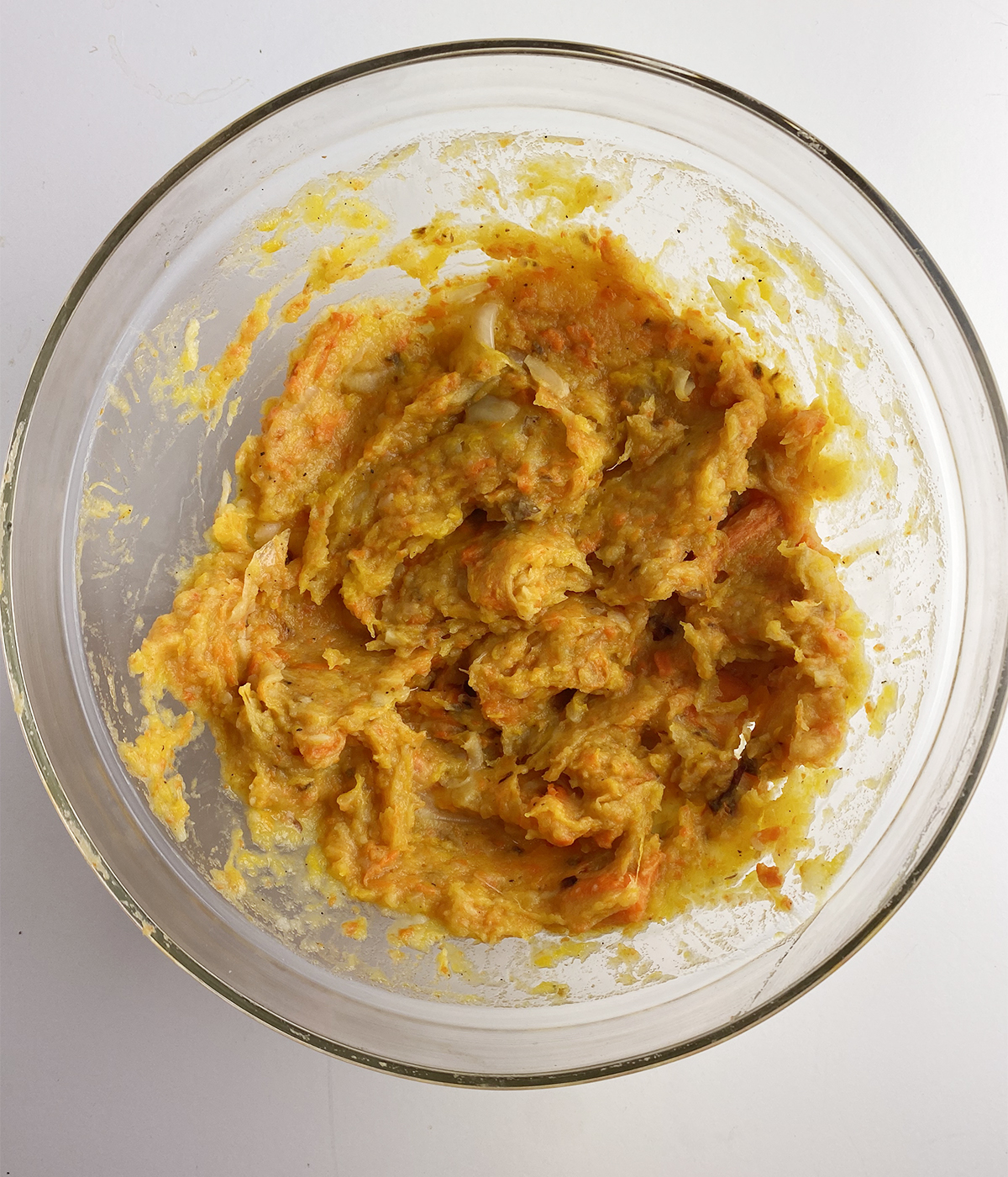 Mashed fall vegetables in a mixing bowl.