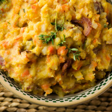 Mashed fall vegetables in a bowl.