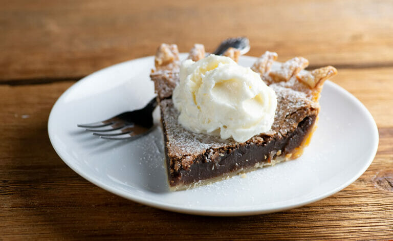 Chocolate chess pie on a plate.