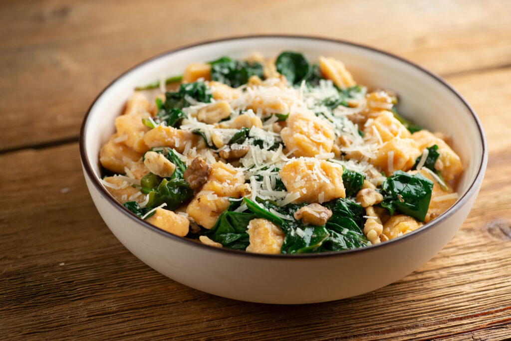 sweet potato gnocchi with spinach and walnuts