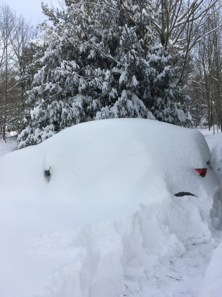 car in snow bank