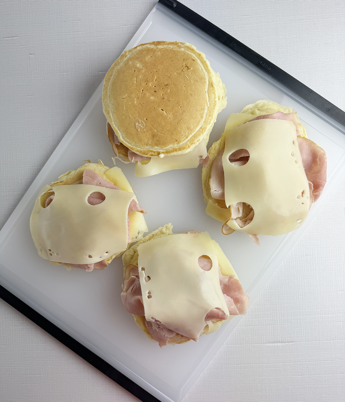 Pancake breakfast sandwiches being assembled.