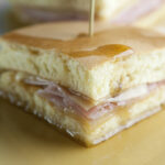 Pancake breakfast sandwiches on a plate.
