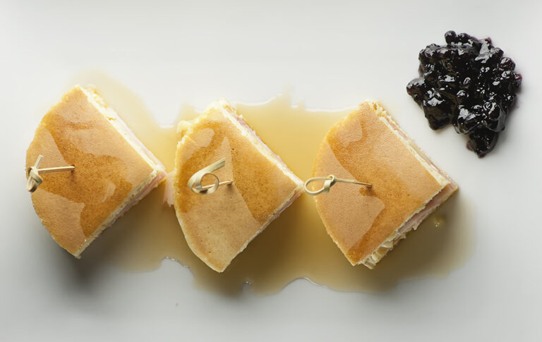 Pancake breakfast sandwiches with jam.