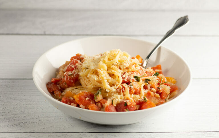 Pasta with Clam Marinara Sauce in a bowl with a fork.