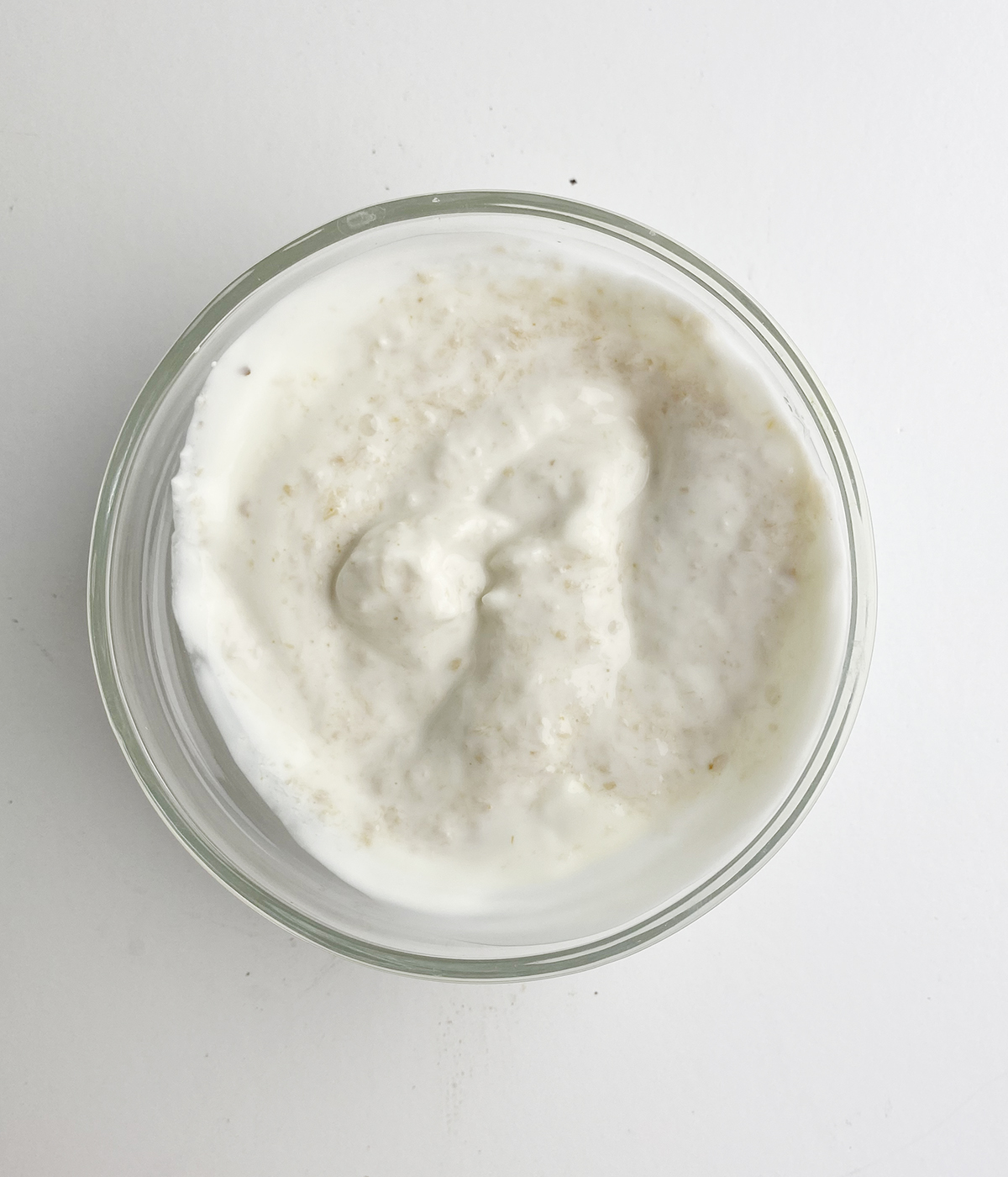 Horseradish cream sauce in a glass bowl.