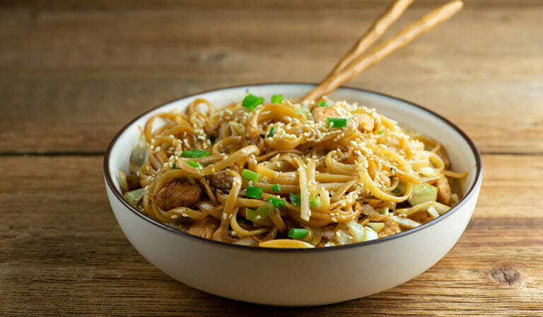 Longevity Noodles in a bowl with chopsticks.