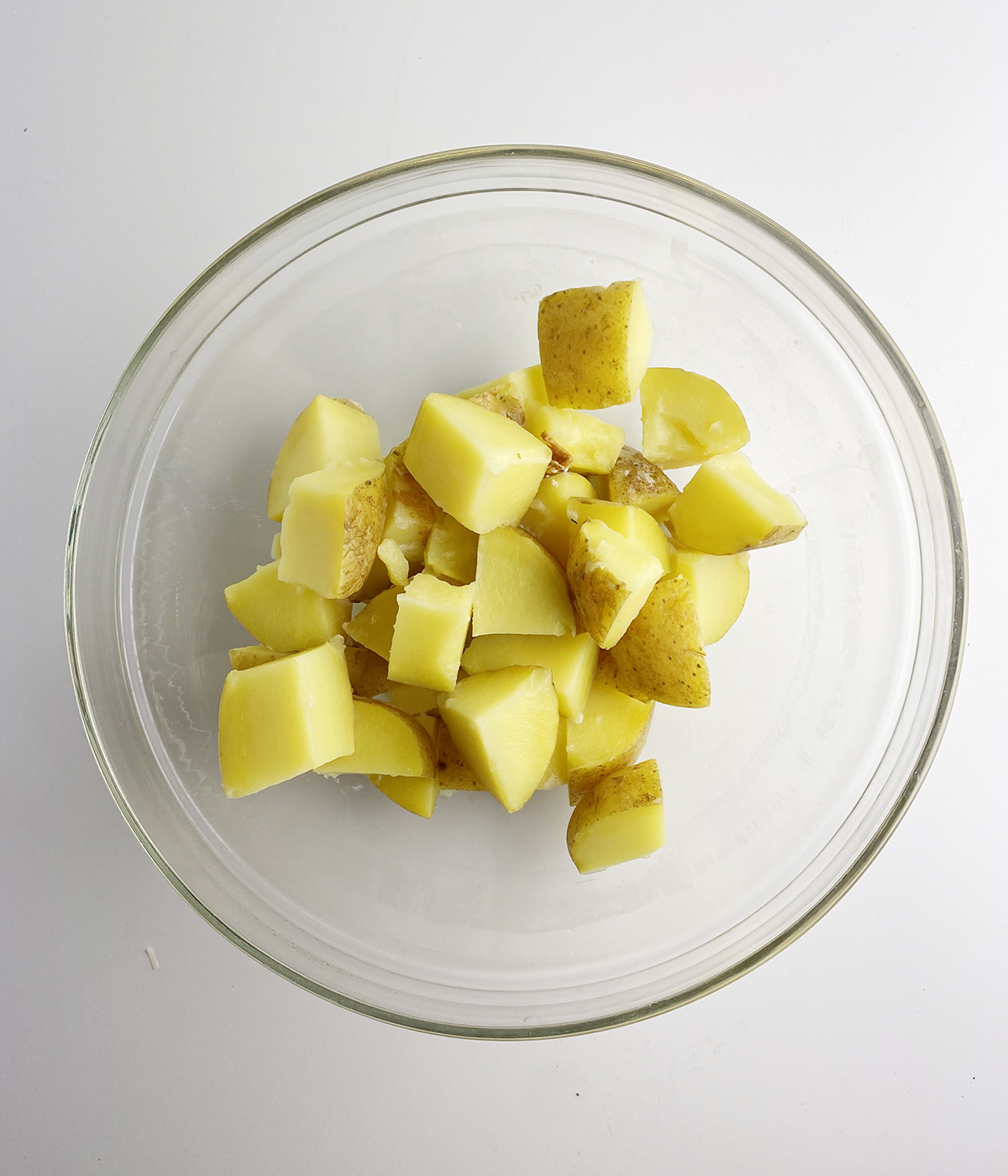 Cooked potato chunks in a bowl.