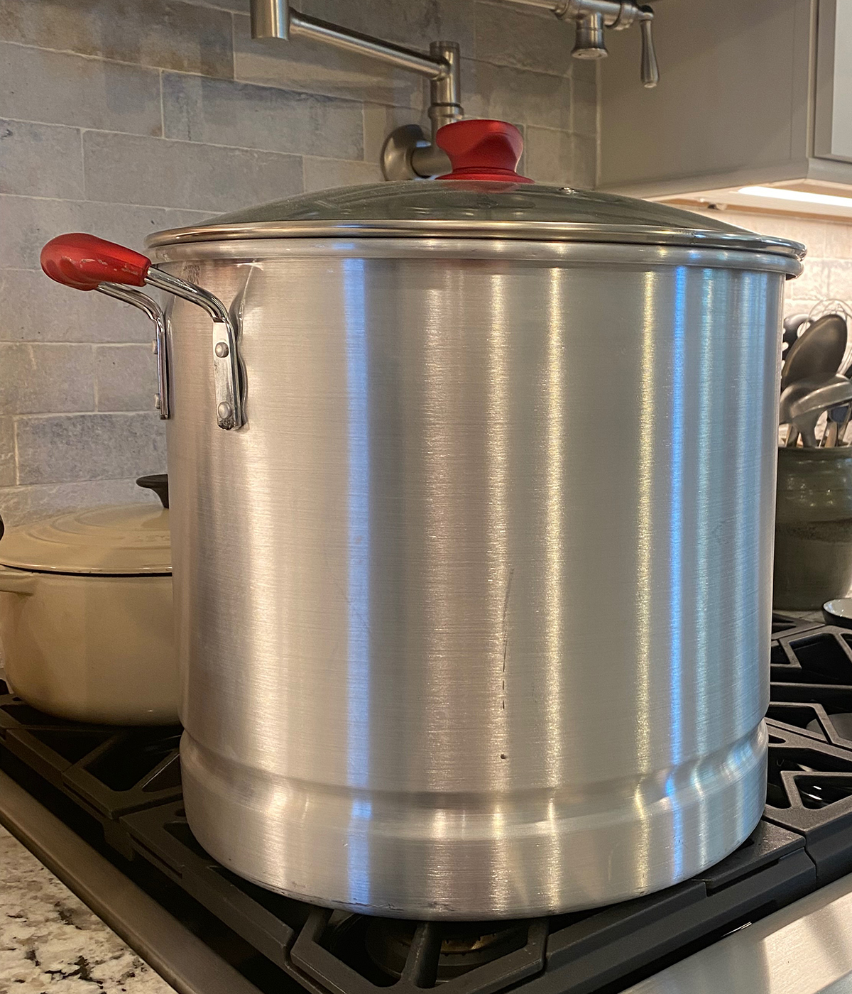 Extra large cooking pot on a stovetop.