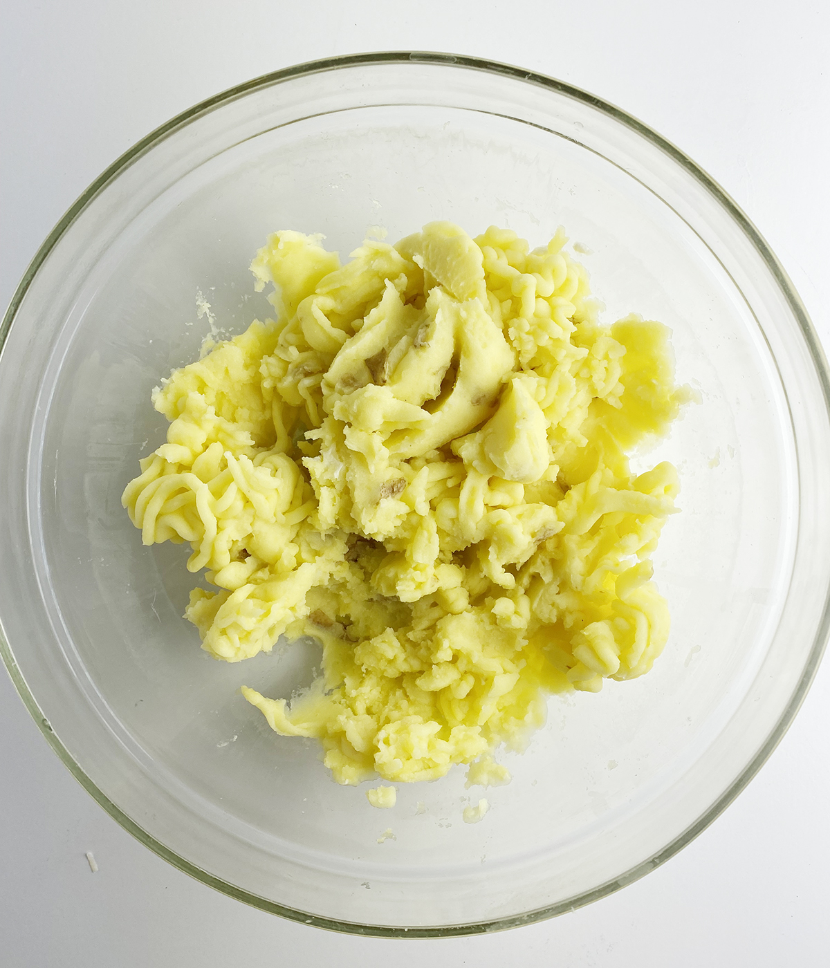 Mashed potatoes in a mixing bowl.