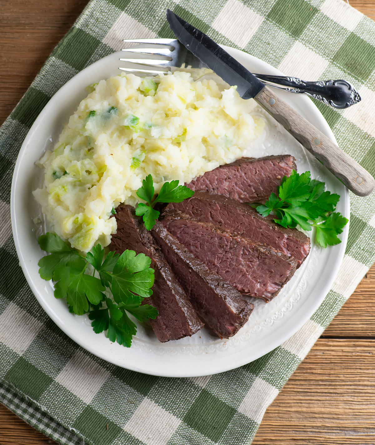 Sliced corned beef on a plate.