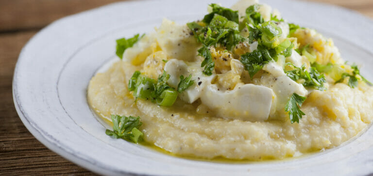Torn egg salad on a plate.