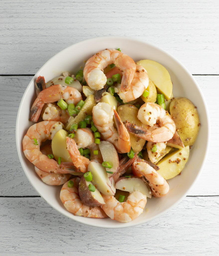 Shrimp potato salad in a bowl.