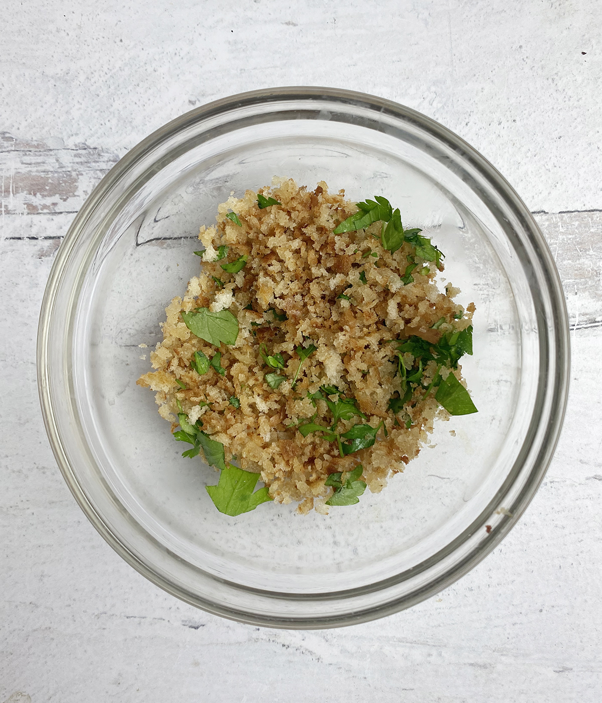 Toasted bread crumb and herb mixture in a bowl.