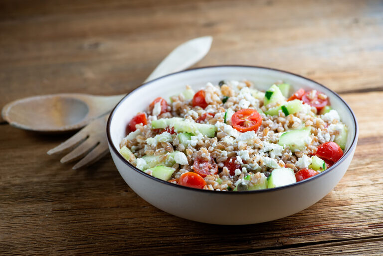 Greek grain salad in a bowl.