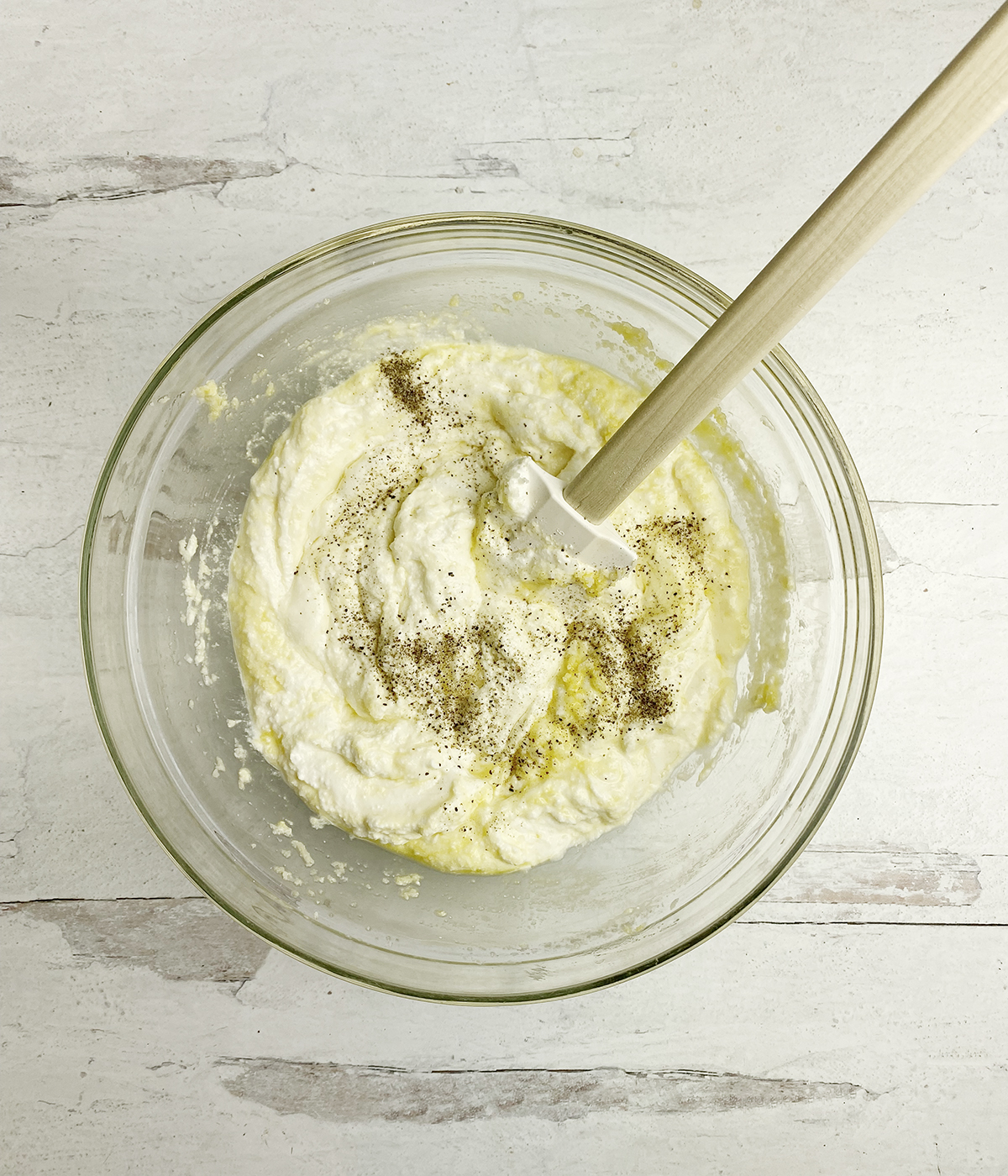 Ricotta egg and Parmesan mixture in a bowl.