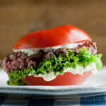 Tomato Bun Burger on a plate.